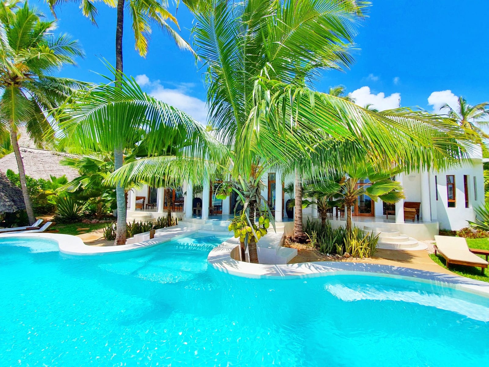 Villa Kidosho — the white Omani-style villa behind its turquoise pool