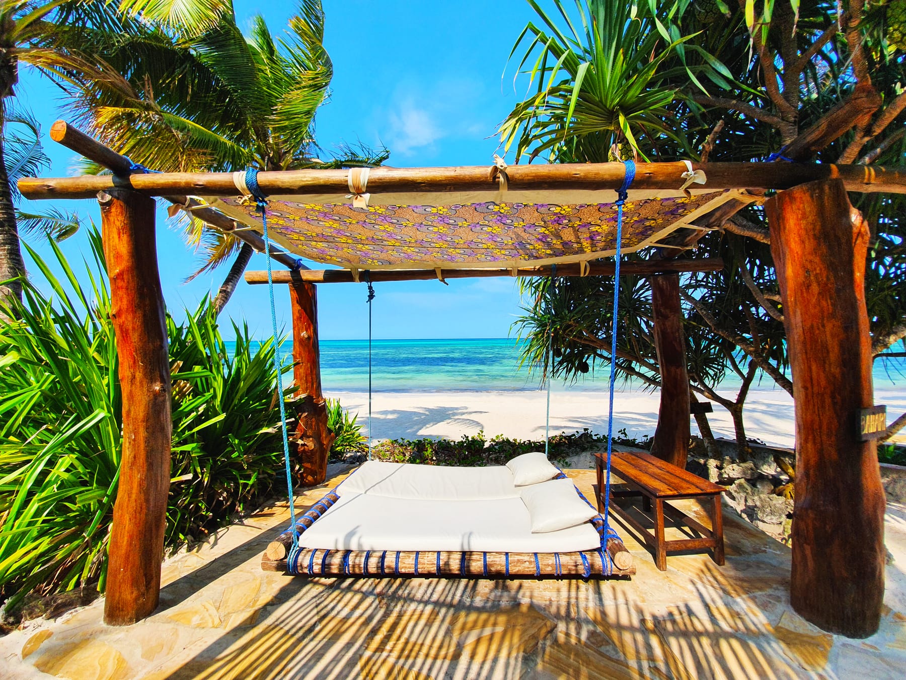 The swing bed at Asili House, facing the water.