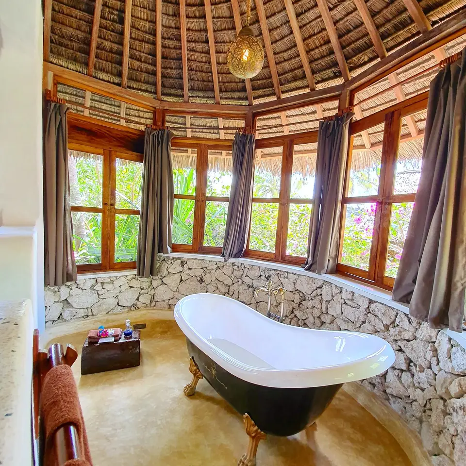 Clawfoot bathtub in Room Dunia at Asili House, Boutique Hotel Matlai Zanzibar, with stunning design and ocean view.