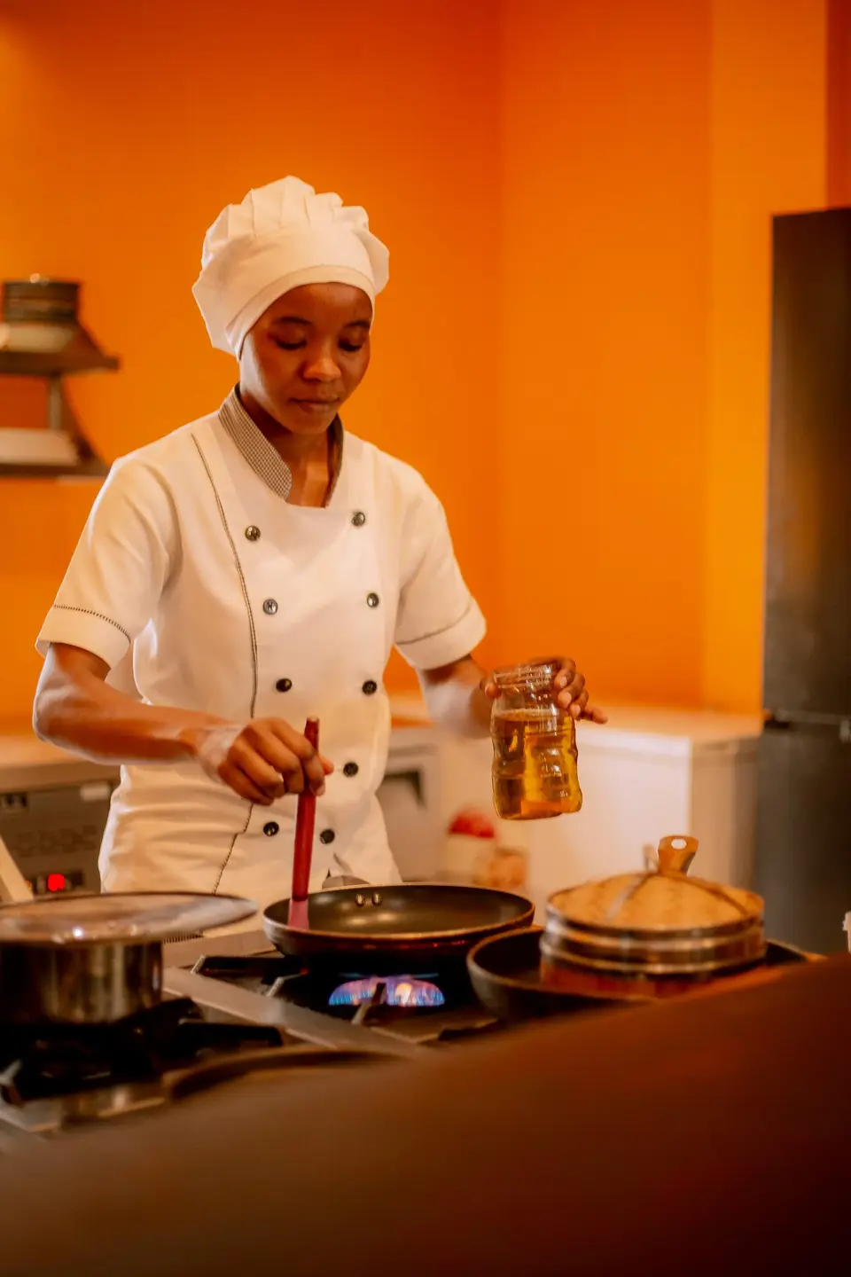 Bertha cooking authentic Vietnamese food, including Pho, for the Duyen by Kim menu at Boutique Hotel Matlai Zanzibar.