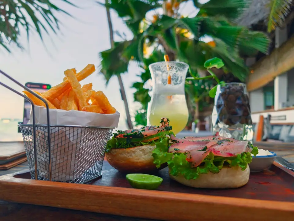 Cured tuna burger with crispy fries served at Zatiny Restaurant, Boutique Hotel Matlai Zanzibar.