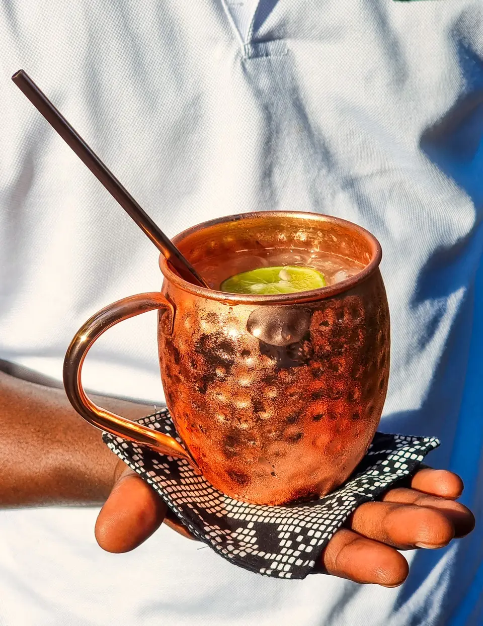 Moscow Mule cocktail at Zatiny Restaurant, Boutique Hotel Matlai Zanzibar, refreshing ginger and lime drink.