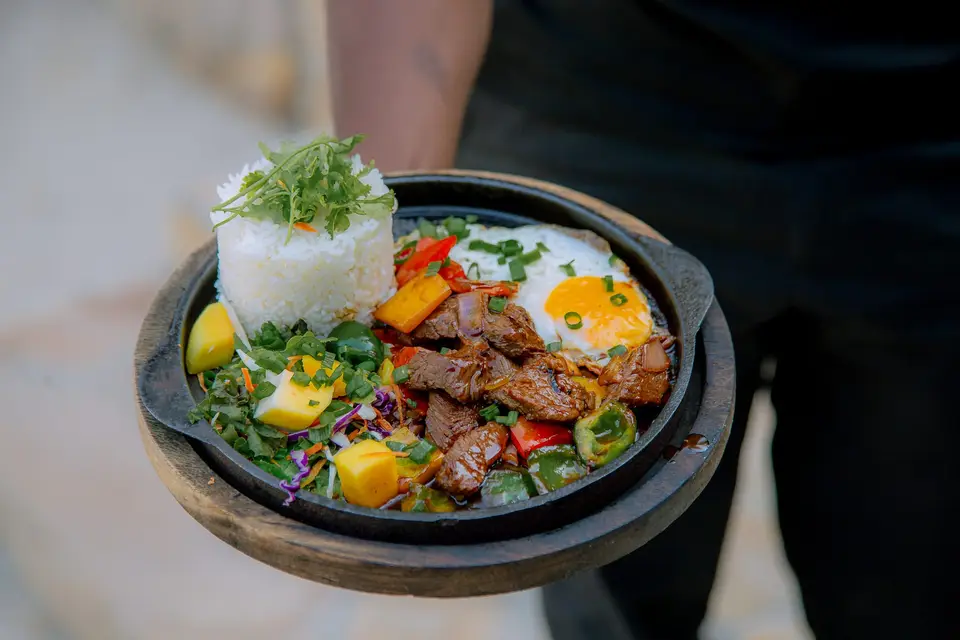 Shaking Beef served on a hot sizzling plate from the Duyen by Kim menu at Boutique Hotel Matlai Zanzibar.